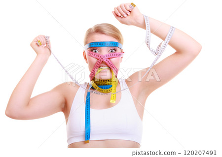 Obsessed fitness woman with a lot of colorful measure tapes Obsessed fitness woman with a lot of colorful measure tapes 120207491