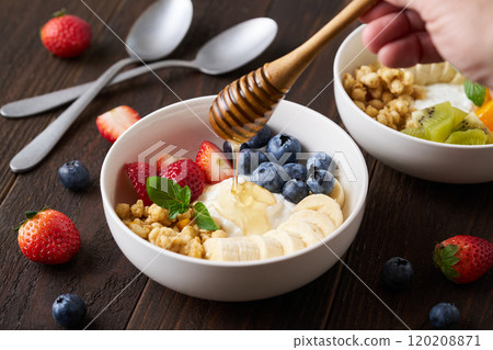 Greek yogurt bowl with honey 120208871