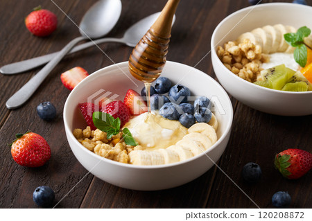 Greek yogurt bowl with honey Greek yogurt bowl with honey 120208872