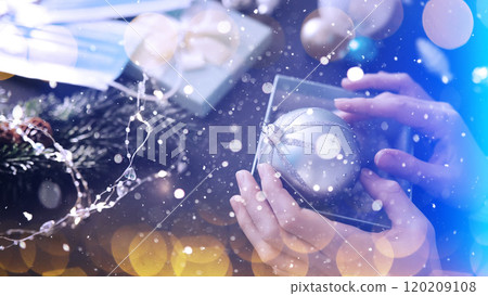 Snow Christmas background balls and Medical protective masks. New Year 2021 is coming. New Year and coronavirus concept. Copy space. Snow Christmas background balls and Medical protective masks. New Year 2021 is coming. New Year and coronavirus concept. Copy space. 120209108