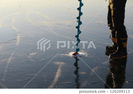 Ice ax - ice screws on winter fishing on the ice caves. Ice is very clean and beautiful. The Lake Baikal. Ice ax - ice screws on winter fishing on the ice caves. Ice is very clean and beautiful. The Lake Baikal. 120209113