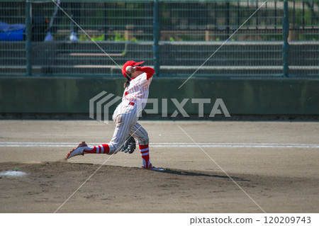 Youth baseball game scene Female pitcher 120209743