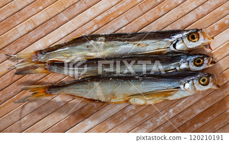 Image of air-dried salted sabrefish on wooden background 120210191