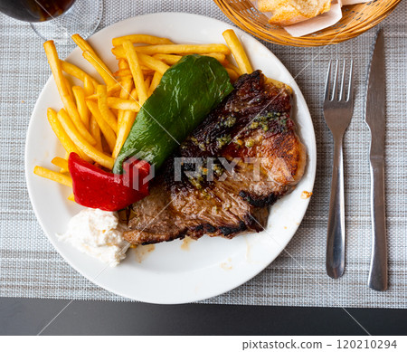 Pork escalope with fried potatoes, baked pepper and cream cheese dip Pork escalope with fried potatoes, baked pepper and cream cheese dip 120210294