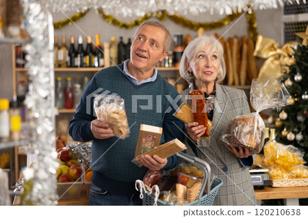 Elderly spouses choose consider nougat, panettone, marzipan, cookies, chocolate 120210638