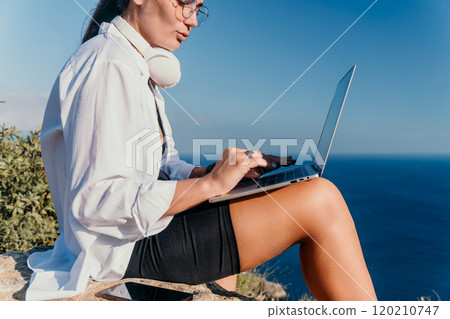 Woman Laptop Ocean View Working Remotely on Cliffside Woman Laptop Ocean View Working Remotely on Cliffside 120210747