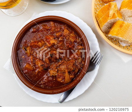 Portion of stewed tripe is cooked in plate - stomach of cattle Portion of stewed tripe is cooked in plate - stomach of cattle 120210975
