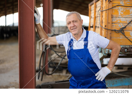 Mature man is employee of company during break in work Mature man is employee of company during break in work 120211076