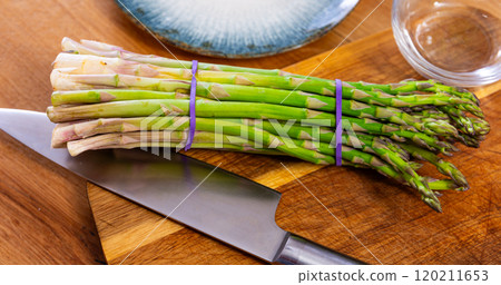 Fresh green asparagus served at table Fresh green asparagus served at table 120211653