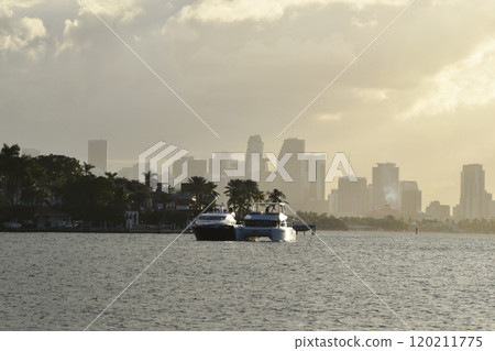 Luxury yacht and houses at the canal in Miami Beach Luxury yacht and houses at the canal in Miami Beach 120211775