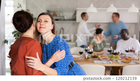 Two women greet each other when meeting 120212139