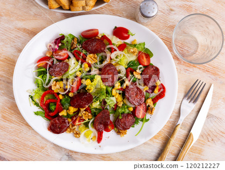 Salad with chorizo, corn and peppers Salad with chorizo, corn and peppers 120212227