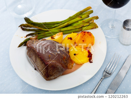 Grilled beef steak with fried potato and asparagus 120212263