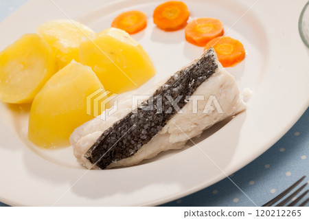 Pollock prepared on steam, served with boiled potatoes and carrots Pollock prepared on steam, served with boiled potatoes and carrots 120212265