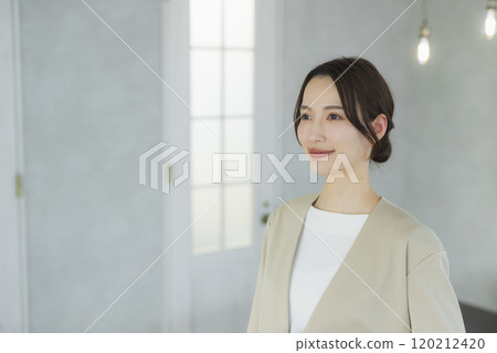 Young woman in a suit 120212420