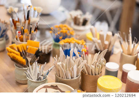 Brushes and tools for sculpting in ceramic workshop 120212694