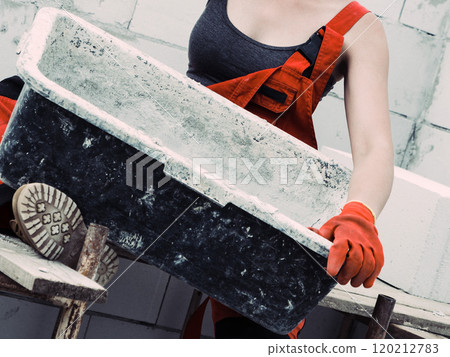 Female builder working build new house 120212783