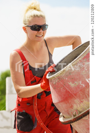 Strong woman working with construction site Strong woman working with construction site 120212809