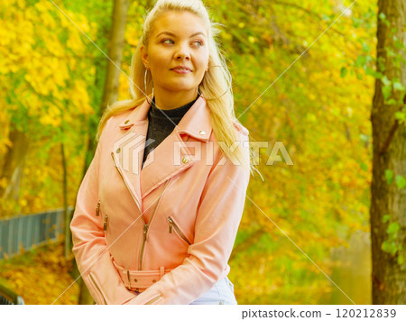 Fashion woman walking in autumn park 120212839