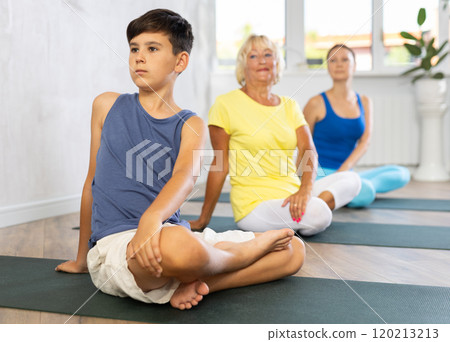 Family three generations do exercise half lotus position Sidhasana with body twist pose Family three generations do exercise half lotus position Sidhasana with body twist pose 120213213