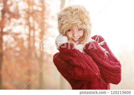 Portrait of pretty smiling woman in fur winter hat Portrait of pretty smiling woman in fur winter hat 120213600