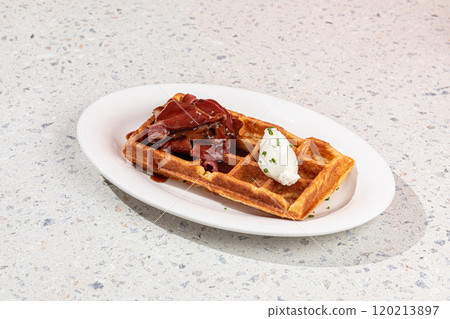 Portion of waffle with brisket and cream cheese Portion of waffle with brisket and cream cheese 120213897