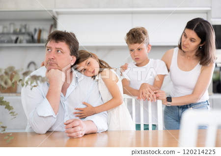 Family with two children in kitchen during quarrel Family with two children in kitchen during quarrel 120214225