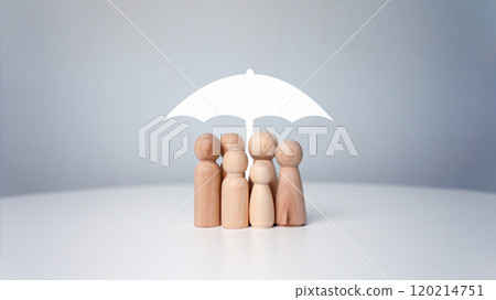 Protect and care for your family, umbrella above a family cover and shelter wooden people, security, protection, Finance or insurance concept, People lifestyles and Relationships in love concept. Protect and care for your family, umbrella above a family cover and shelter wooden people, security, protection, Finance or insurance concept, People lifestyles and Relationships in love concept. 120214751