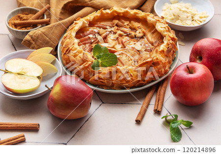 Delicious homemade apple galette with fresh apples, almond slices, and spices Delicious homemade apple galette with fresh apples, almond slices, and spices 120214896