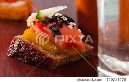 Canape with salmon and mango sauce Canape with salmon and mango sauce 120215076