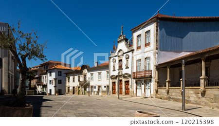 Cobbled street of Portuguese city of Mirandela with church 120215398