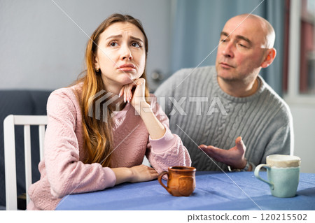 Man tries to comfort his upset wife 120215502