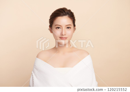 Beautiful young asian woman with clean fresh skin on beige background, Face care, Facial treatment, Cosmetology, beauty and spa, Asian women portrait. 120215552