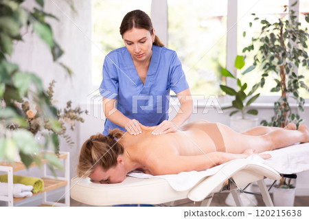 Woman relax during massage spine 120215638