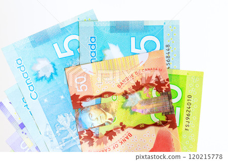 Counting Canadian dollars in various denominations banknotes cash Counting Canadian dollars in various denominations banknotes cash 120215778