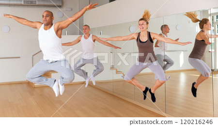 Young adult people jumping at dance class Young adult people jumping at dance class 120216246