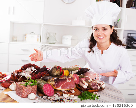 Cook woman with smoked products 120216360