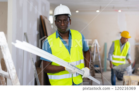 Repairman working in construction site in apartment Repairman working in construction site in apartment 120216369