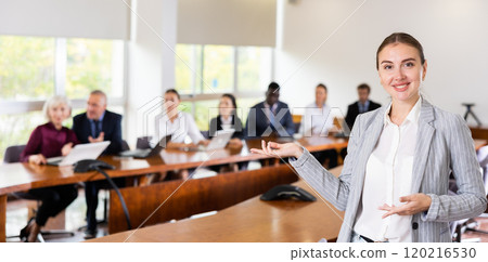 Portrait of positive woman secretary gesturing in meeting room Portrait of positive woman secretary gesturing in meeting room 120216530