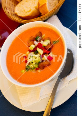 Spanish cold soup gazpacho in bowl with tomatoes and cucumber 120216534