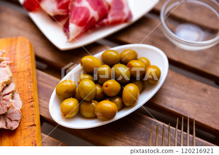 Pickled green olives with a stone 120216921