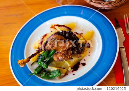 Duck confit in port with pear chutney 120216925
