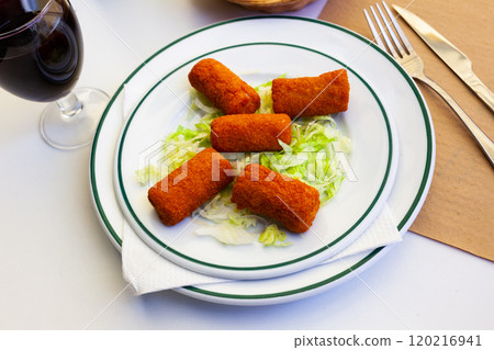 Popular tapa of Cordoba Flamenquin with salad Popular tapa of Cordoba Flamenquin with salad 120216941