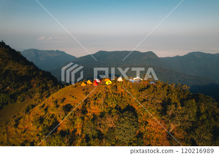 Aerial view of a tent in a grassland on a mountain. 120216989