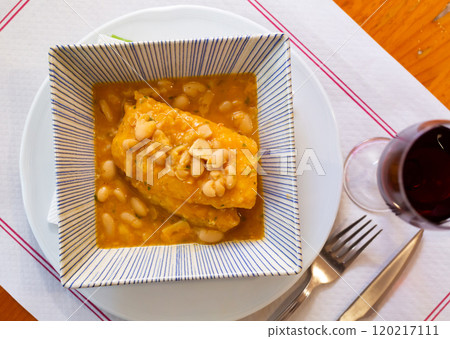 Canned cod with beans served on platter Canned cod with beans served on platter 120217111