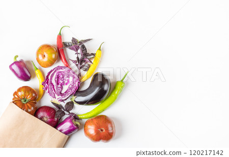 Fresh vegetables, peppers, tomatoes, cabbage, basil, eggplant in paper bag on light gray background with place for text. Flat lay. Healthy food, fresh healthy vegetables from the garden Fresh vegetables, peppers, tomatoes, cabbage, basil, eggplant in paper bag on light gray background with place for text. Flat lay. Healthy food, fresh healthy vegetables from the garden 120217142