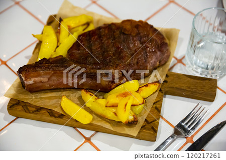 Delicious beef entrecote with fries potatoes Delicious beef entrecote with fries potatoes 120217261