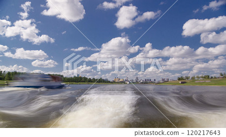 Astana, Kazakhstan. View from Pleasure boat on the river Ishim timelapse hyperlapse drivelapse in Astana. 120217643