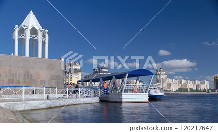 Boat station near embankment on the river Ishim timelapse in Astana. 120217647