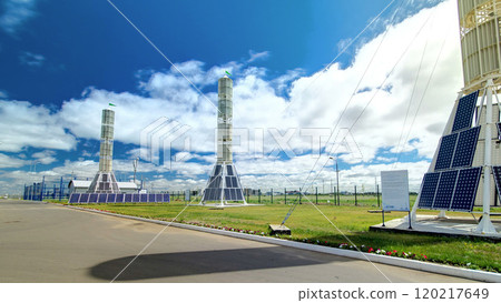 Solar Panel towers on solar plant with High Voltage Tower in Background timelapse hyperlapse Solar Panel towers on solar plant with High Voltage Tower in Background timelapse hyperlapse 120217649
